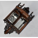 An Edwardian Mahogany Wall Hanging Mirrored Corner Shelf Unit with Raised and Pierced Gallery