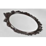 A Late 19th Century Carved and Pierced Framed Oval Wall Mirror, 100cms by 64cms Overall