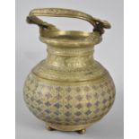 A North Indian/Persian Vessel with looped Handle, The Body with Geometric Decoration and Engraved