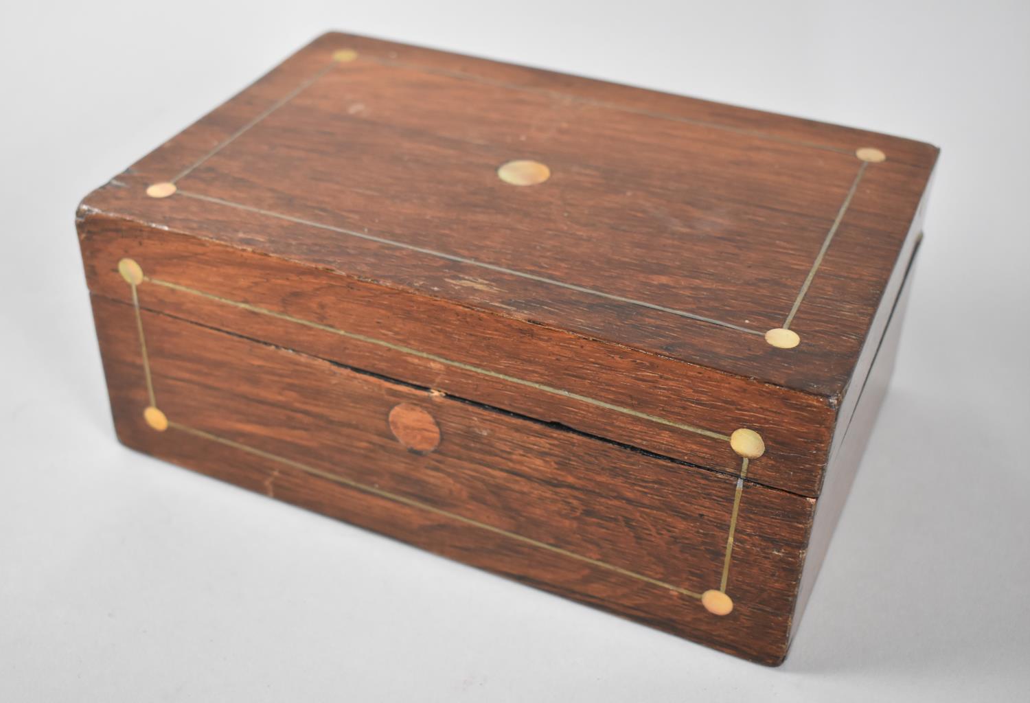 A Late 19th century Rosewood Work Box with Mother of Pearl String and Disc Inlay, one Hinge Requires