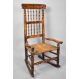A 19th Century Spindle Back Rush Seated Rocking Nursing Chair
