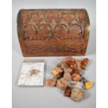 A Far Eastern Carved and Brass Mounted Dome Topped Box Containing Fragments of Raw Amber, Mammoth