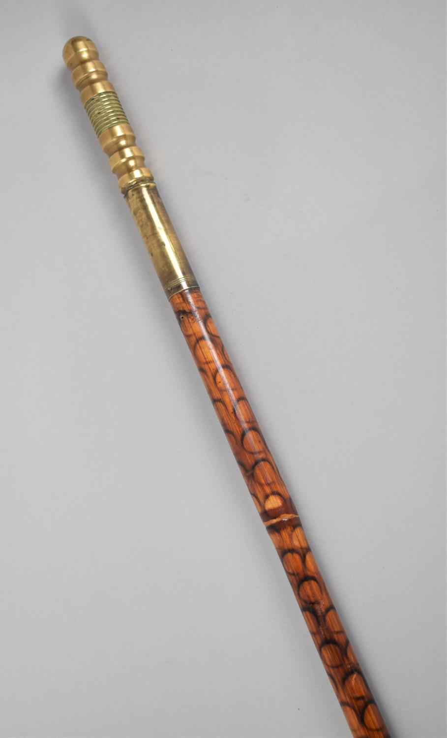 A Colonial Brass Handled Dagger Stick with Painted Bamboo Shaft, 86cms Long