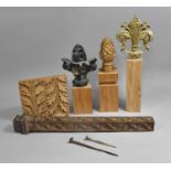 A Collection of Various Finials on Plinth Bases together with Carved Wooden Pilasters having