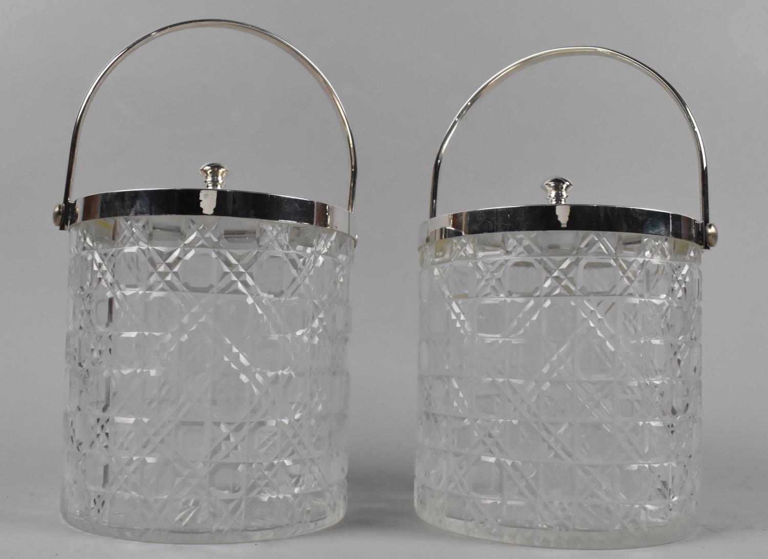 A Pair of Silver Plate Topped Cut Glass Biscuit Barrels with Loop Handles, 12cms Diameter