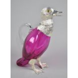 A Reproduction Silver Plated and Pink Glass Claret Jug with Hinged Birds head, 25cms High