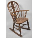 A Small Windsor Style Hooped Back Rocking Chair with Pierced Splat