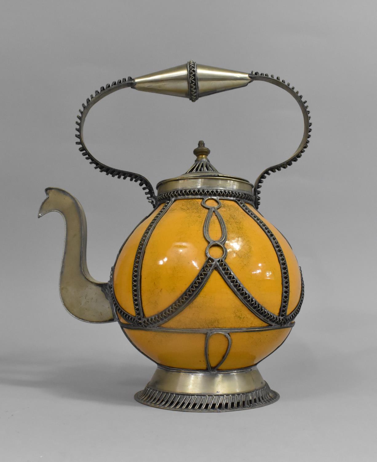 A Tunisian White Metal and Ceramic Coffee Pot, 28cms High