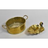 An Oval Brass Pan together with a Brass Bed Chamber Stick with Scalloped Shell Tray