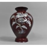 A Red Lacquer and Mother of Pearl Inlaid Vase of Baluster Form Decorated with Cranes, 25cm high