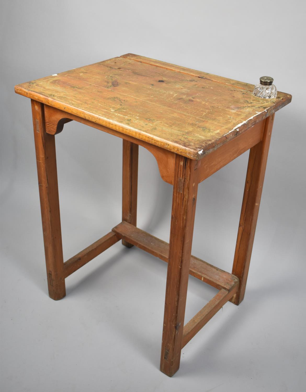 A Stained Pine Work Desk with Inset Glass Inkwell, 60cms Wide and 77cms High