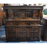 A Mid 20th Century Oak Court Cupboard Having Three Centre Drawers Over Cupboard Base, Raised