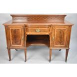 A Pretty Edwardian Inlaid and Galleried Sideboard with Centre Drawer Flanked by Shelved Cupboards,
