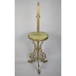 A Mid 20th Century Brass and Onyx Lamp with Circular Display Shelf and Tripod Support in the Form of