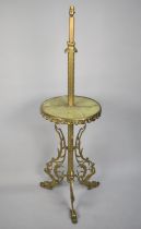 A Mid 20th Century Brass and Onyx Lamp with Circular Display Shelf and Tripod Support in the Form of