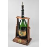 A Mid 20th Century Wooden Pouring Stand For Remy Martin Cognac together with Empty Six Pint