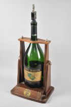 A Mid 20th Century Wooden Pouring Stand For Remy Martin Cognac together with Empty Six Pint