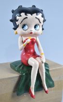A Reproduction Cast Metal Study of Seated Betty Boop Holding Microphone, 27cms High, Plus VAT