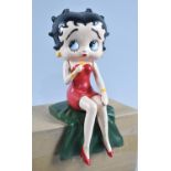 A Reproduction Cast Metal Study of Seated Betty Boop Holding Microphone, 27cms High, Plus VAT