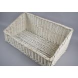 A White Painted Wicker Basket, 59cm wide