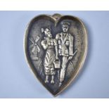 A Novelty WWII Novelty Brass Ashtray in the Form of a Heart, with Dutch Girl and Soldier, 11cms High