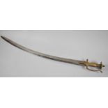 A Brass Handled Indian Talwar Sword with Curved Engraved Blade