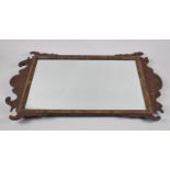 A Georgian Style Fret Cut Mahogany and Walnut Wall Mirror, 62cm High and 40cm wide