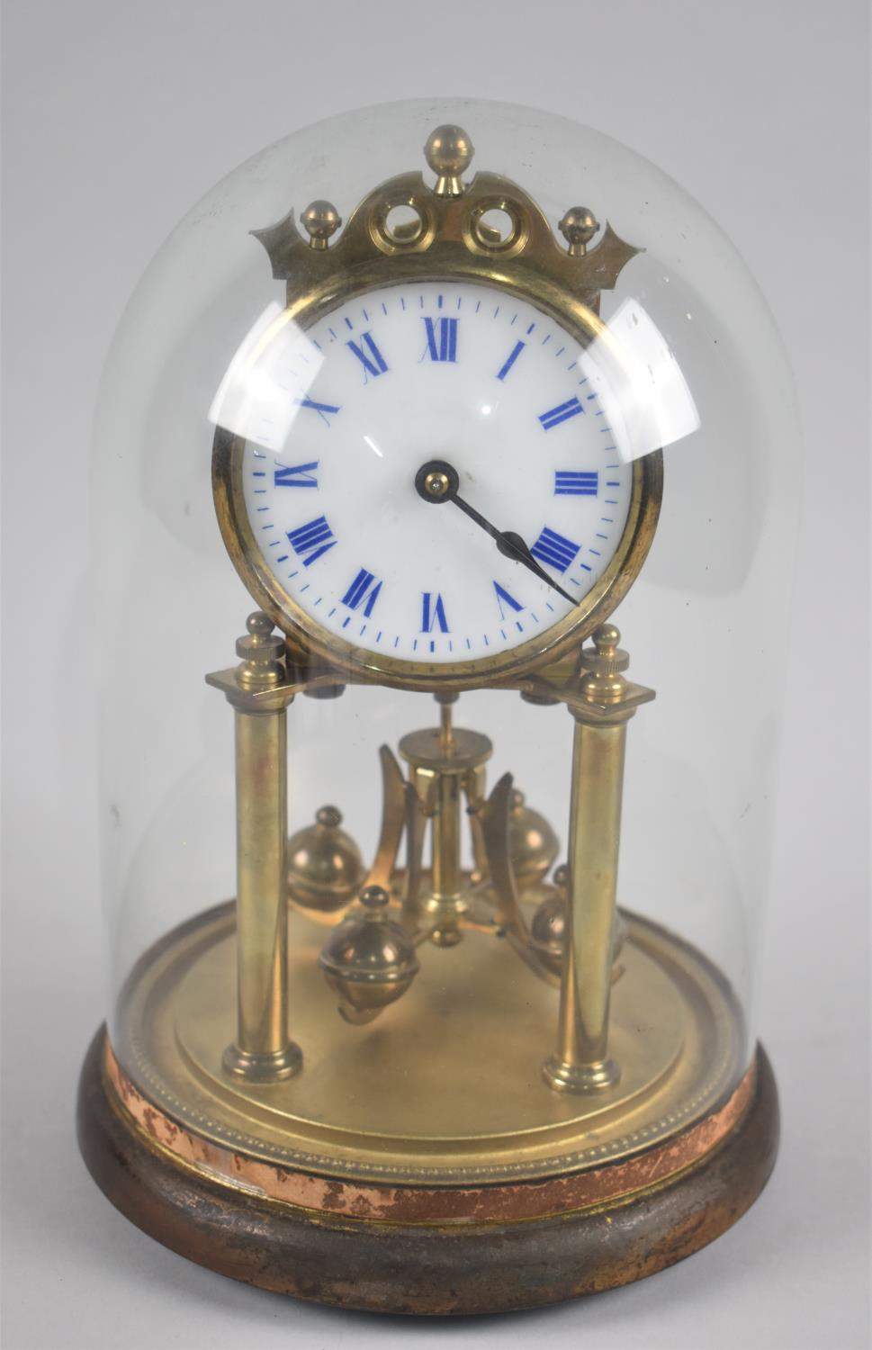 A German Brass Pillar Clock Under Glass Dome, 26.5cms High