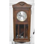 An Edwardian Oak Wall Clock