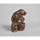 A Small Oriental Carved Netsuke in the Form of a Mouse Playing Drum, 4.5cm high