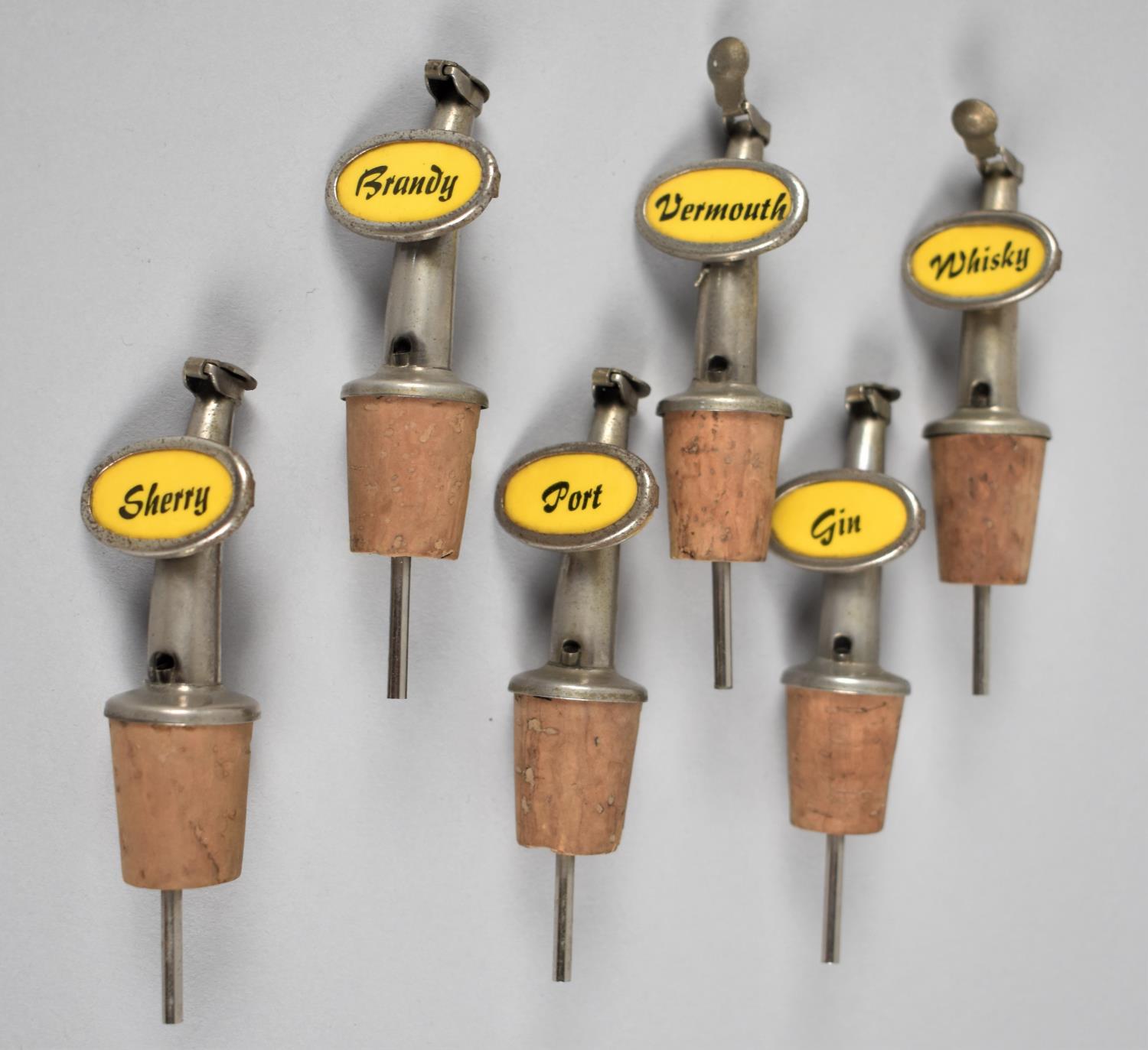 A Collection of Six Mid 20th Century Bottle Pourers for Whisky, Brandy, Gin, Port, Sherry and