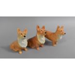 A Collection of Three Corgi Ornaments