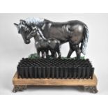 A Modern Reproduction Cast Metal Boot Brush, with Mare and Foal Decoration on Four Scrolled Feet,