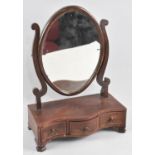 A 19th century Mahogany Swing Dressing Table Mirror with Oval Glass on Serpentine Crossbanded Plinth