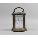 A Miniature Brass Carriage Clock of Oval Form, The White Enamelled Dial Inscribed for Matthew