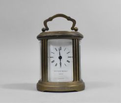 A Miniature Brass Carriage Clock of Oval Form, The White Enamelled Dial Inscribed for Matthew