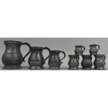 A Collection of Various 19th Century Pewter Measuring Jugs