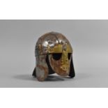 A Small Tin Plate and Brass Copy of the Sutton Hoo Saxon Helmet, 9cm High