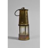 A Miniature Brass Miners Safety Lamp, 13cms High