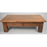 A Large Heavy Oak Rectangular Coffee Table with Two Drawers, 134cms Wide