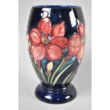 A Moorcroft Blue Glazed Vase, 18cm high
