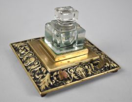 A Desk Top Brass Ink Stand and Pen Rest with Single Glass Inkwell, 13cms Square