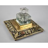 A Desk Top Brass Ink Stand and Pen Rest with Single Glass Inkwell, 13cms Square