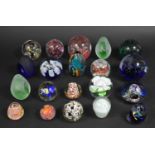 A Collection of Various Glass Paperweights