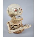 A Reproduction Cast Metal Novelty Money Bank in the Form of a Skeleton, 16cm (Plus VAT)