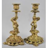A Pair of French Gilt Bronze Figural Candlesticks with Cherub Supports, 22.5cms High