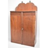 A Mahogany Wall Hanging Shelved Cabinet with Key, 27cms Wide and 45cms High