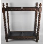 An Edwardian Oak Rectangular Stick Stand with Bobbin Supports and Acorn Finials, 61cms Wide and
