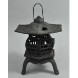 A Modern Cast Iron Oriental Tea Light Stand in the Form of a Pagoda, 33cms High