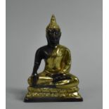 A Far Eastern Gilt Bronze Study of a Seated Buddha on Lotus Throne, 11cms High